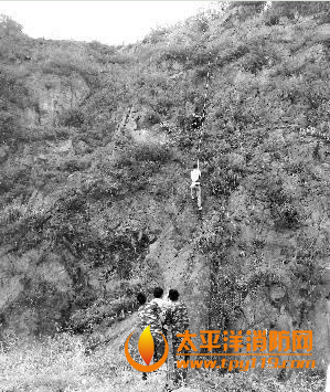 江苏溧阳一小伙被困半山腰